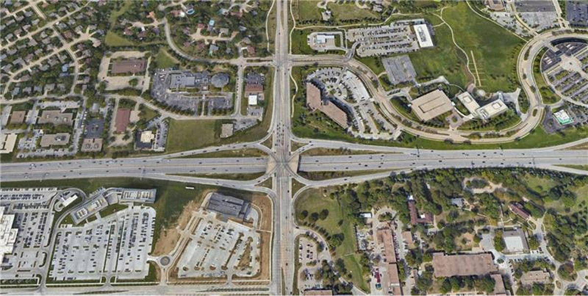Aerial image titled “Where else do we see this?” showing a Single-Point Urban Interchange at 144th and West Dodge Road in Omaha. Source: Omaha Guide.
